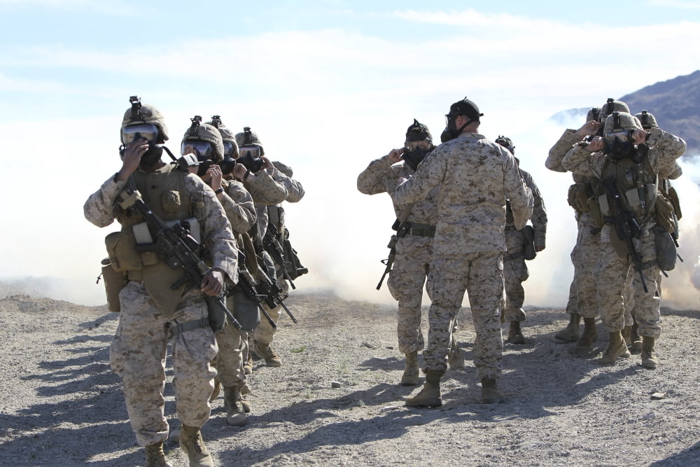 Marines and sailors participate in an outdoor gas exercise in full protective gear Canvas Art - Stocktrek Images (35 x 23)