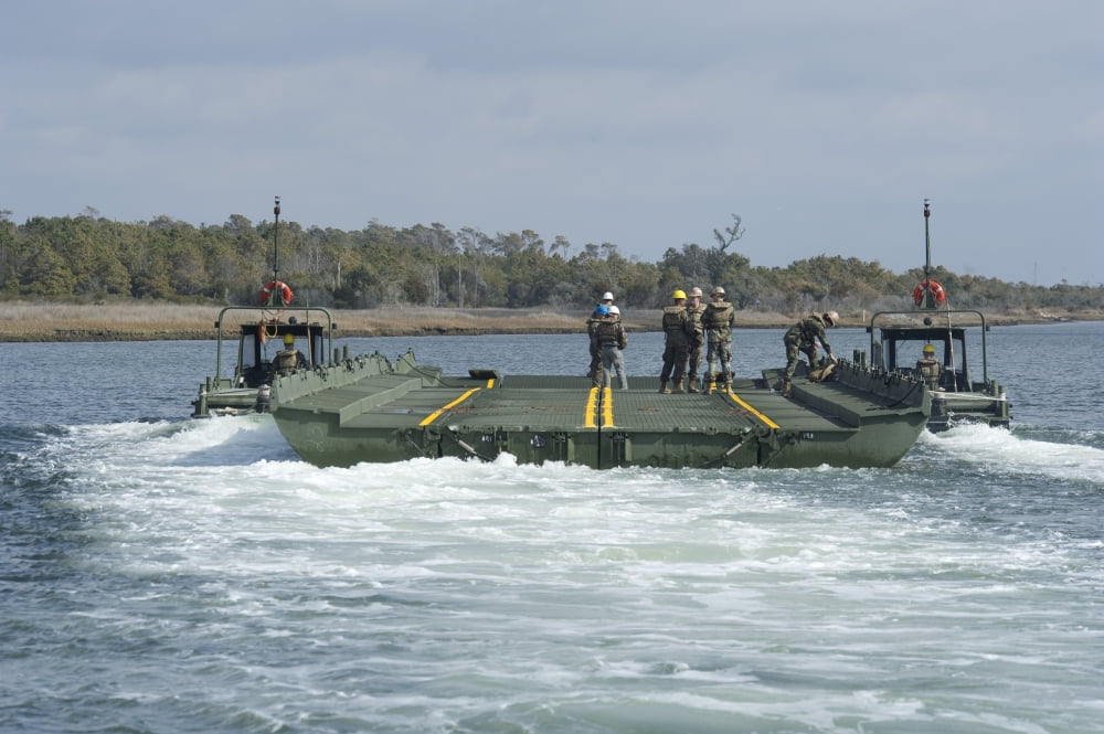 Marines and sailors tow an improved ribbon bridge at Camp Lejeune Canvas Art - Stocktrek Images (35 x 23)