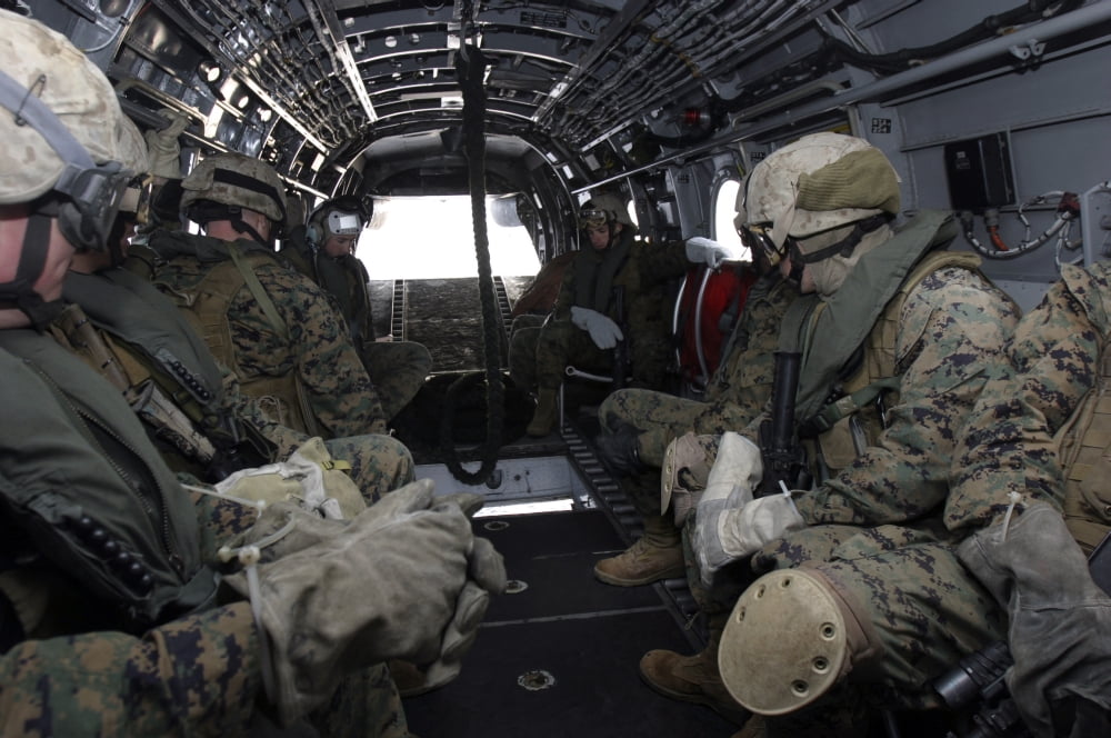 Marines and sailors wait for their time to fast-rope from a CH-46E Sea Knight Canvas Art - Stocktrek Images (34 x 23)