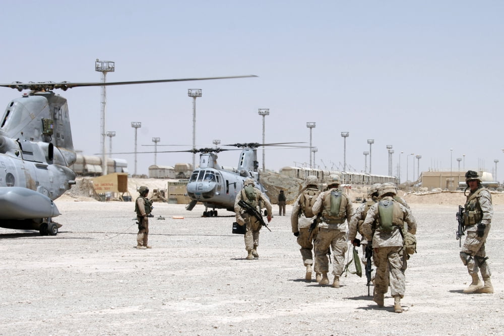 Marines approach two CH-46E helicopters to catch a ride into the battlefield Canvas Art - Stocktrek Images (34 x 23)