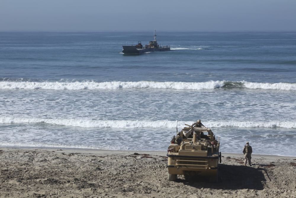 Marines await the arrival of an Improved Navy Lighterage System Canvas Art - Stocktrek Images (35 x 23)