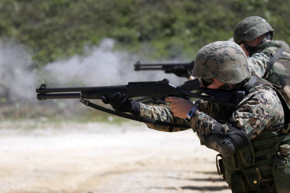 Marines firing shotguns Canvas Art - Stocktrek Images (34 x 23)