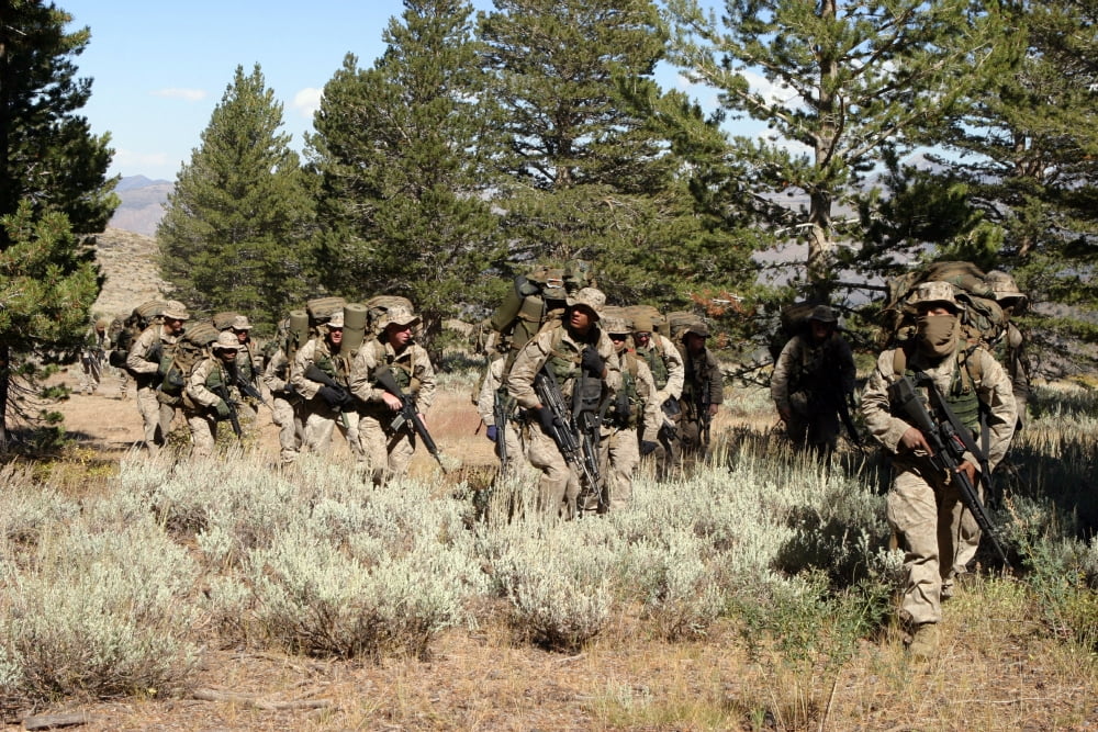 Marines move out for a patrol in the mountains Canvas Art - Stocktrek Images (34 x 23)