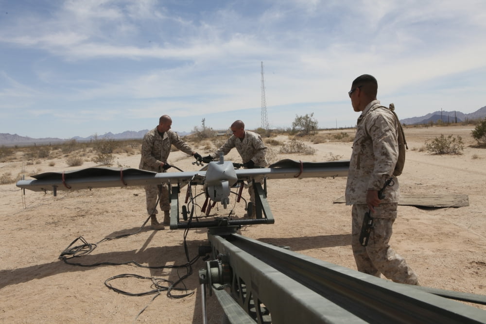 Marines place an RQ-7 Shadow unmanned aerial vehicle on its catapult Canvas Art - Stocktrek Images (35 x 23)
