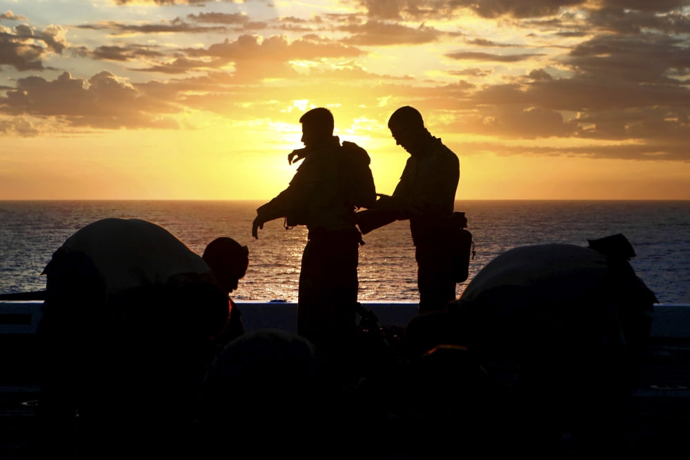 Marines prepare their gear before participating in a live-fire exercise aboard USS New Orleans Canvas Art - Stocktrek Images (35 x 23)