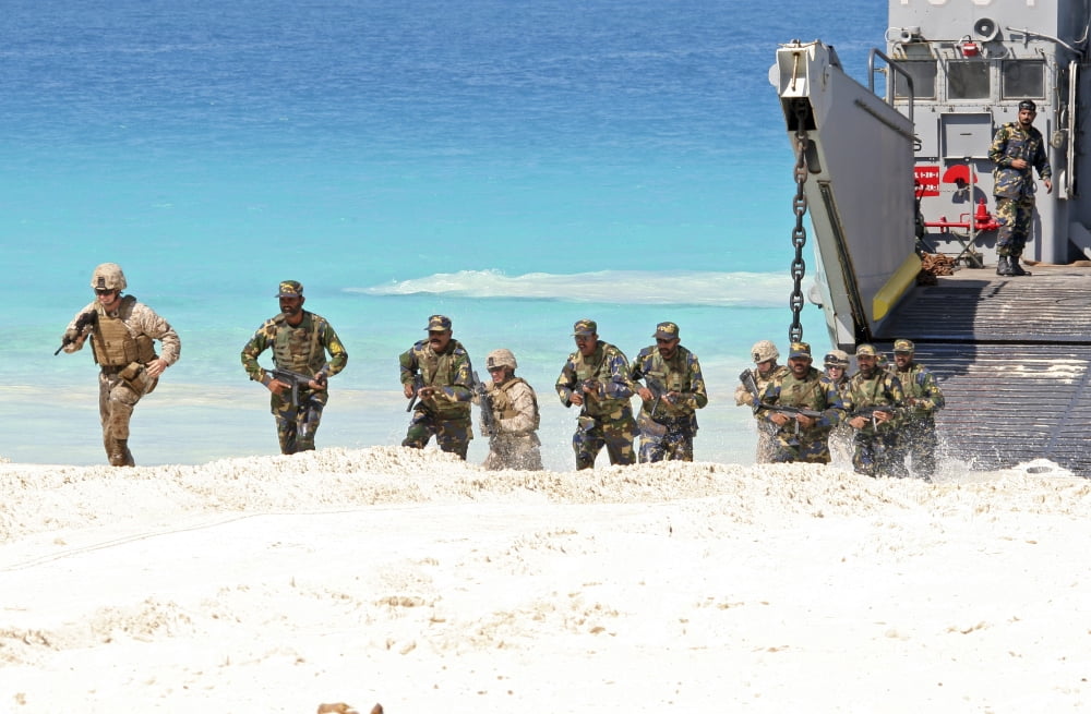 Marines rush ashore from a ling craft utility ship during an amphibious assault Canvas Art - Stocktrek Images (35 x 23)