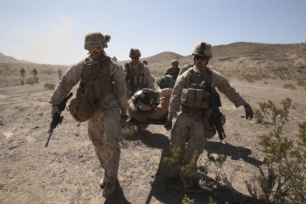 Marines transport a simulated downed pilot to a CH-53 Super Stallion Canvas Art - Stocktrek Images (34 x 23)