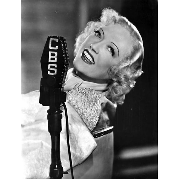 Marion Davies smiling in A Portrait Behind A Microphone in Black and White Photo Print (8 x 10)