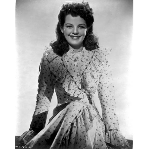 Marjorie Lord on a Printed Dress sitting and smiling Photo Print (8 x 10)