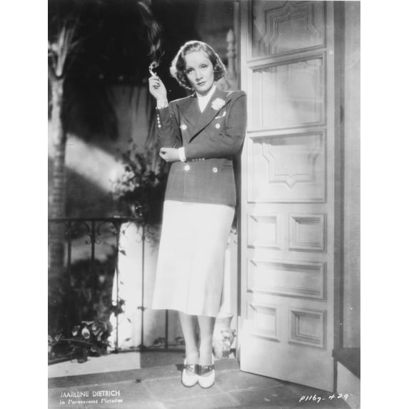 Marlene Dietrich standing in Police Uniform with Cigarette Photo Print (24 x 30)