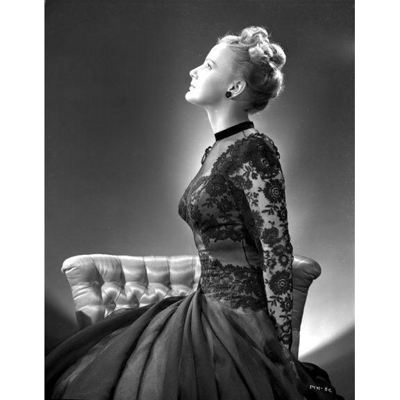 Martha Holliday on an Embroidered Dress sitting on a Couch Photo Print (8 x 10)