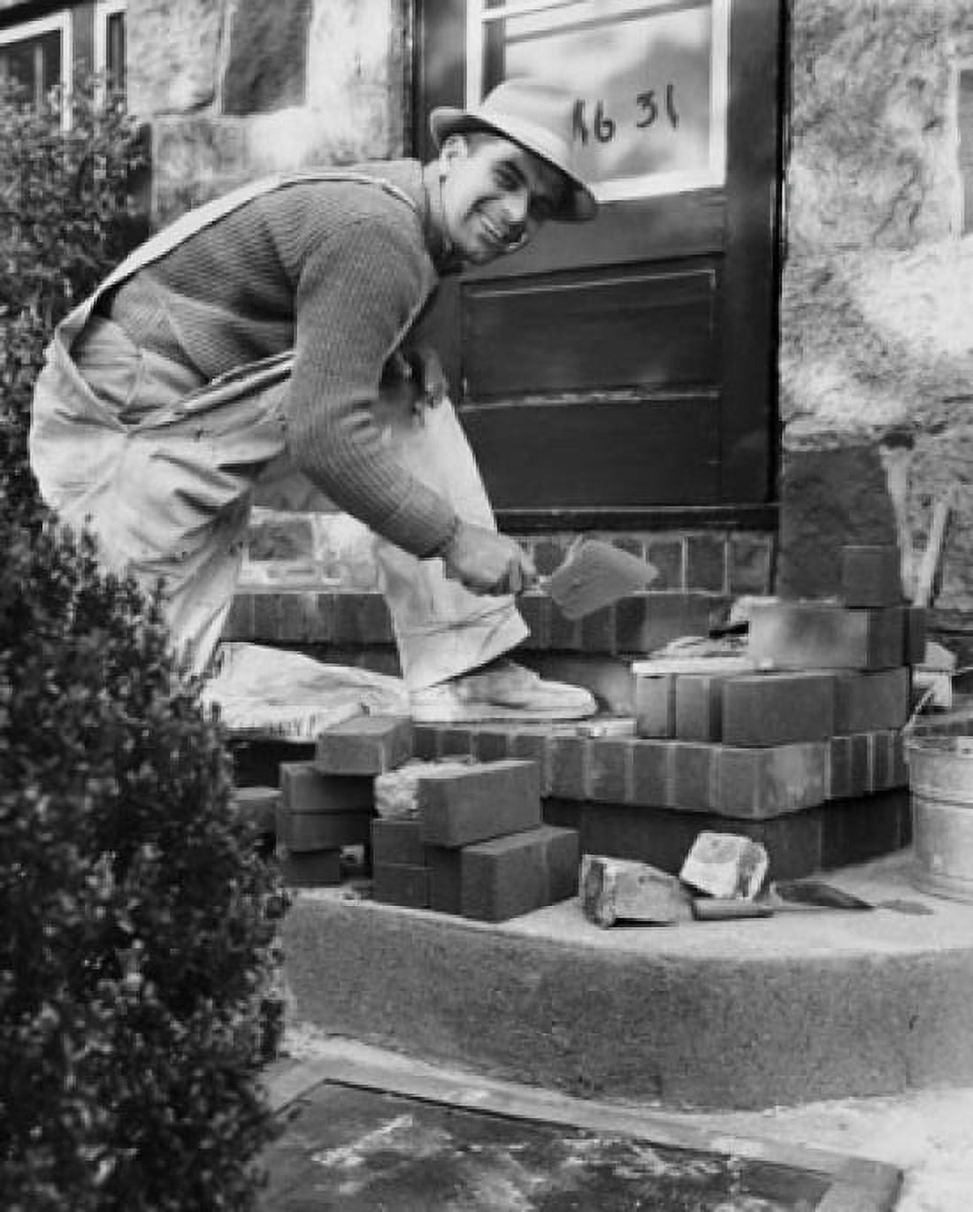 Mason cementing bricks on steps Canvas Art - (24 x 36)