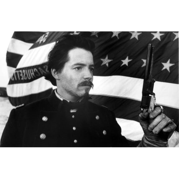 Matthew Broderick in a historical costume carrying a pistol in front of the American flag Photo Print (8 x 10)