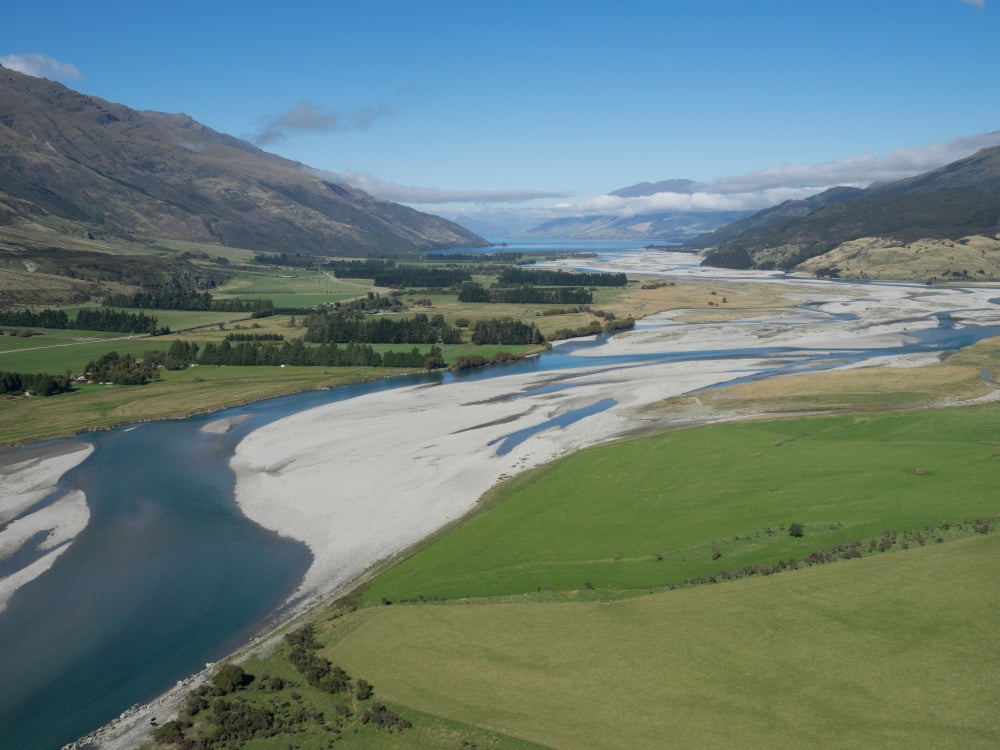 Matukituki River as it flows from Mount Aspiring National Park into Lake Wanaka Queenstown Lake District Otago South Island New Zealand Canvas Art - Panoramic Images (18 x 24)