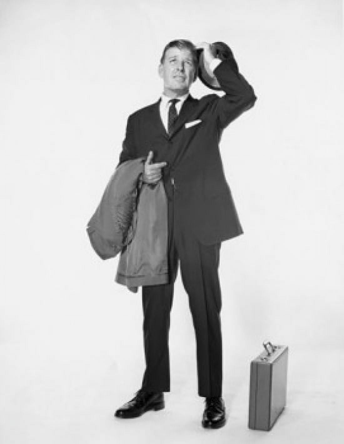 Mature businessman holding hat and overcoat Canvas Art - (18 x 24)