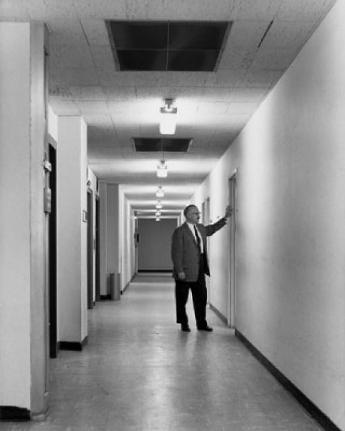 Mature businessman standing in corridor Canvas Art - (24 x 36)