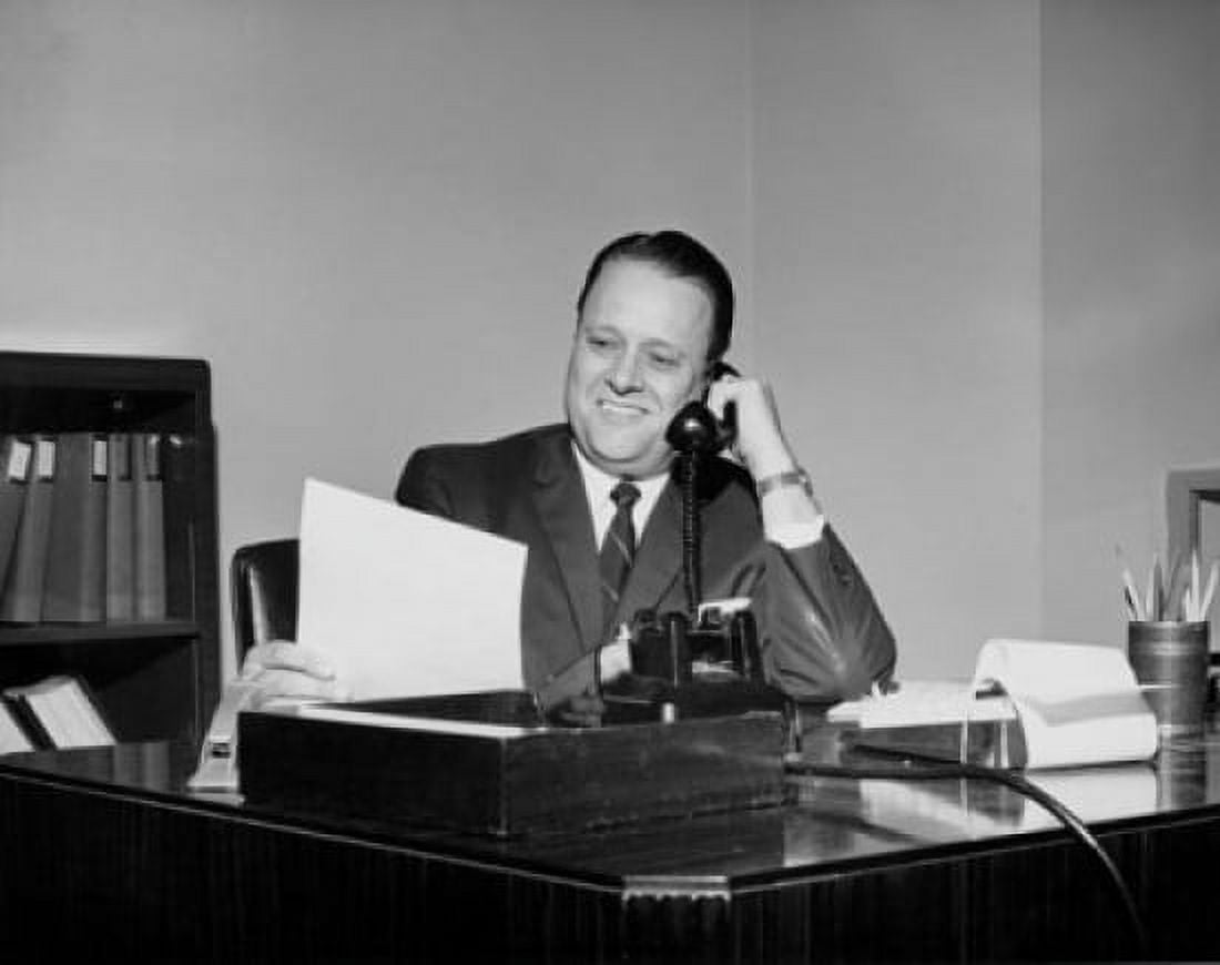 Mature businessman talking on telephone in office Canvas Art - (18 x 24)