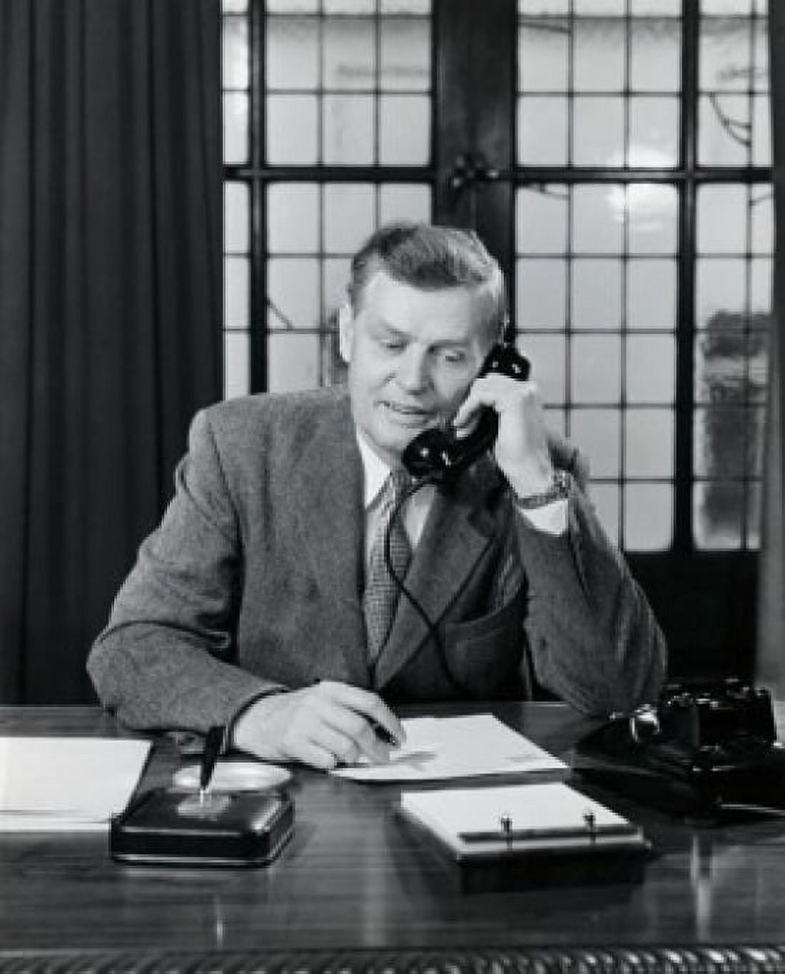 Mature businessman talking on telephone in office Canvas Art - (24 x 36)