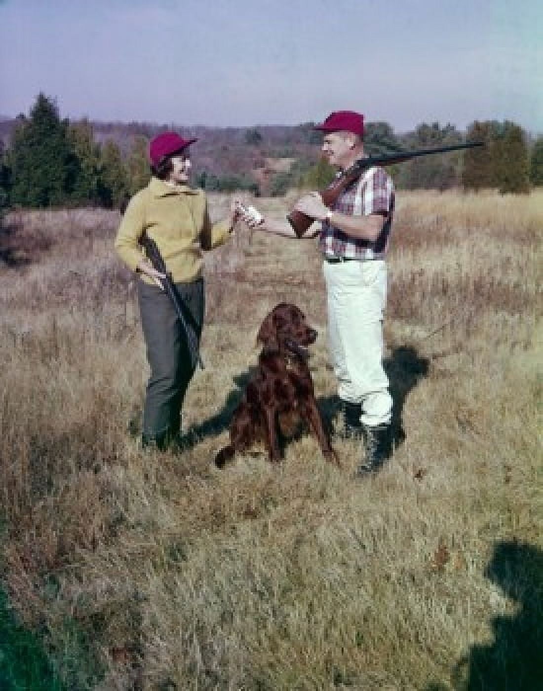 Mature couple and dog hunting Canvas Art - (24 x 36)