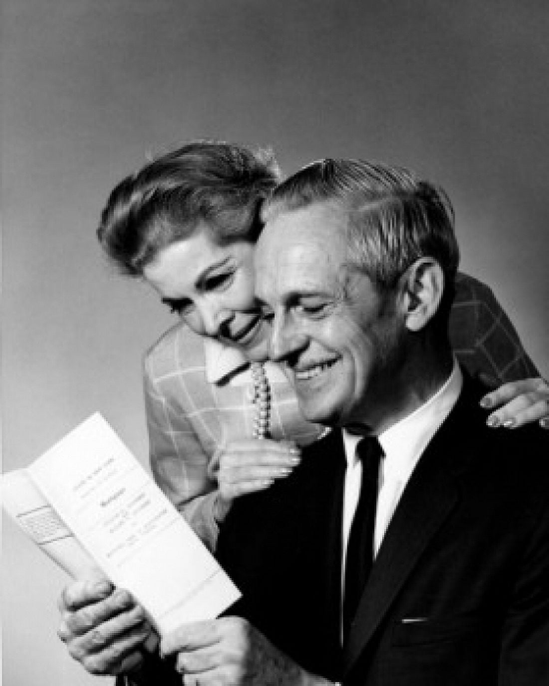 Mature couple reading leaflet Canvas Art - (24 x 36)