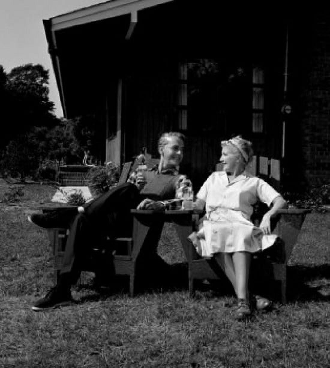 Mature couple relaxing in garden chairs Canvas Art - (18 x 24)