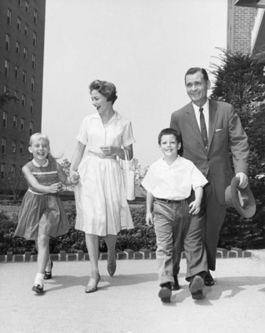 Mature couple walking with their son and daughter Canvas Art -  (18 x 24)