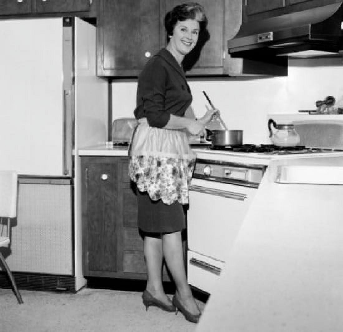 Mature housewife cooking Canvas Art - (24 x 36)
