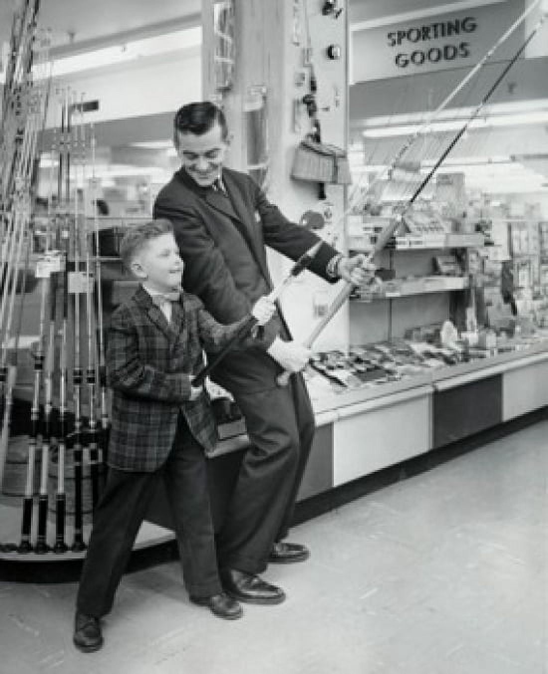 Mature man and boy holding fishing rods in store Canvas Art -  (24 x 36)
