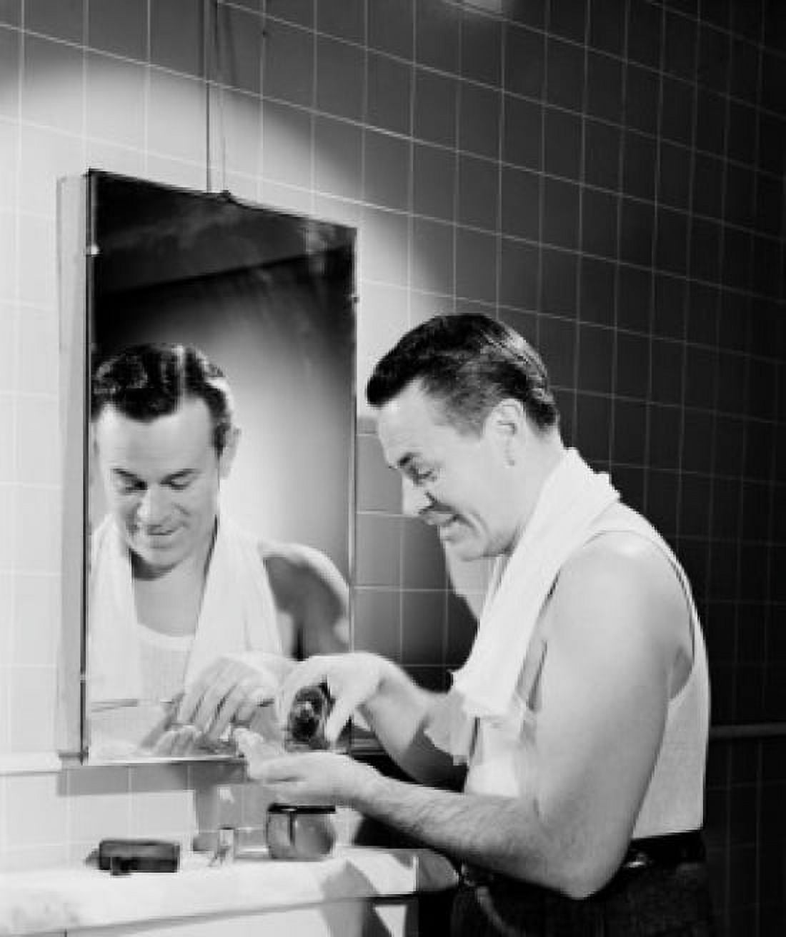 Mature man applying aftershave bathroom Canvas Art - (24 x 36)