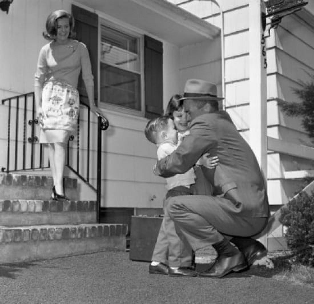 Mature man embracing children wife standing on doorsteps and looking at them Canvas Art - (24 x 36)