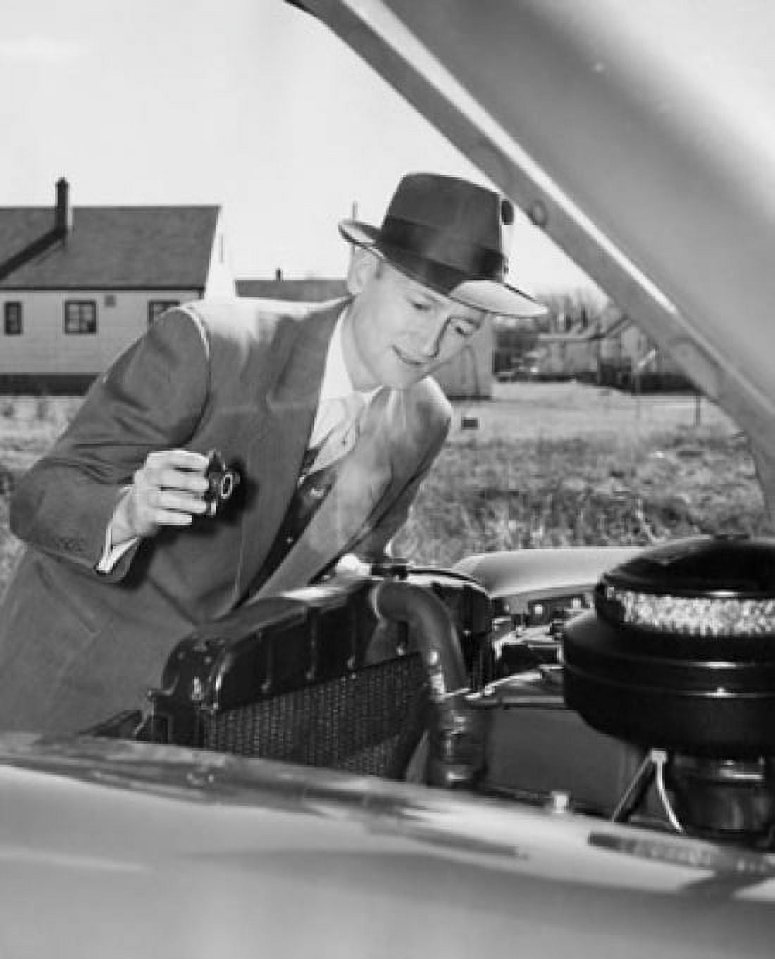 Mature man examining the engine of his car Canvas Art - (18 x 24)