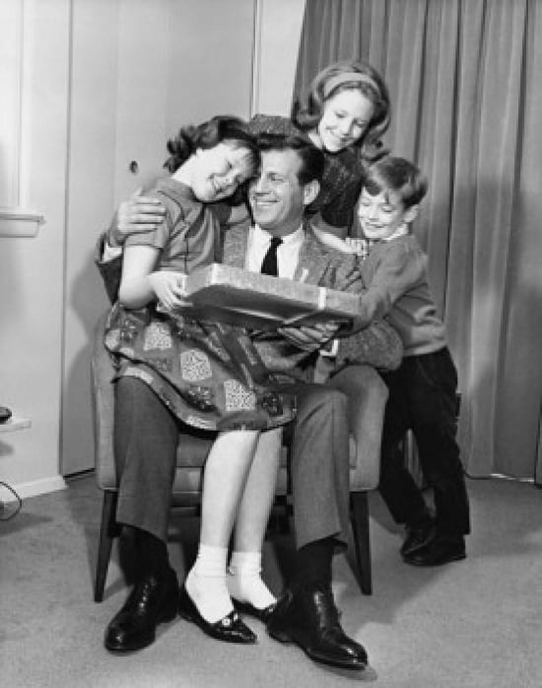 Mature man giving a birthday present to his daughter with his wife and son standing beside them Canvas Art - (24 x 36)
