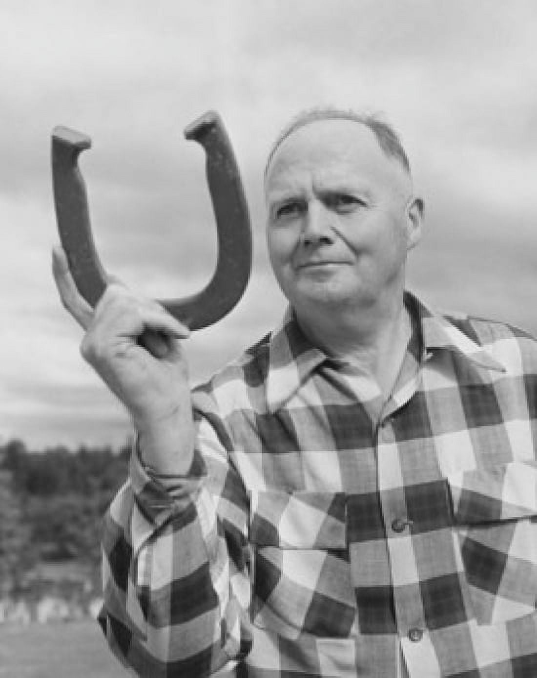 Mature man holding a horseshoe Canvas Art - (24 x 36)