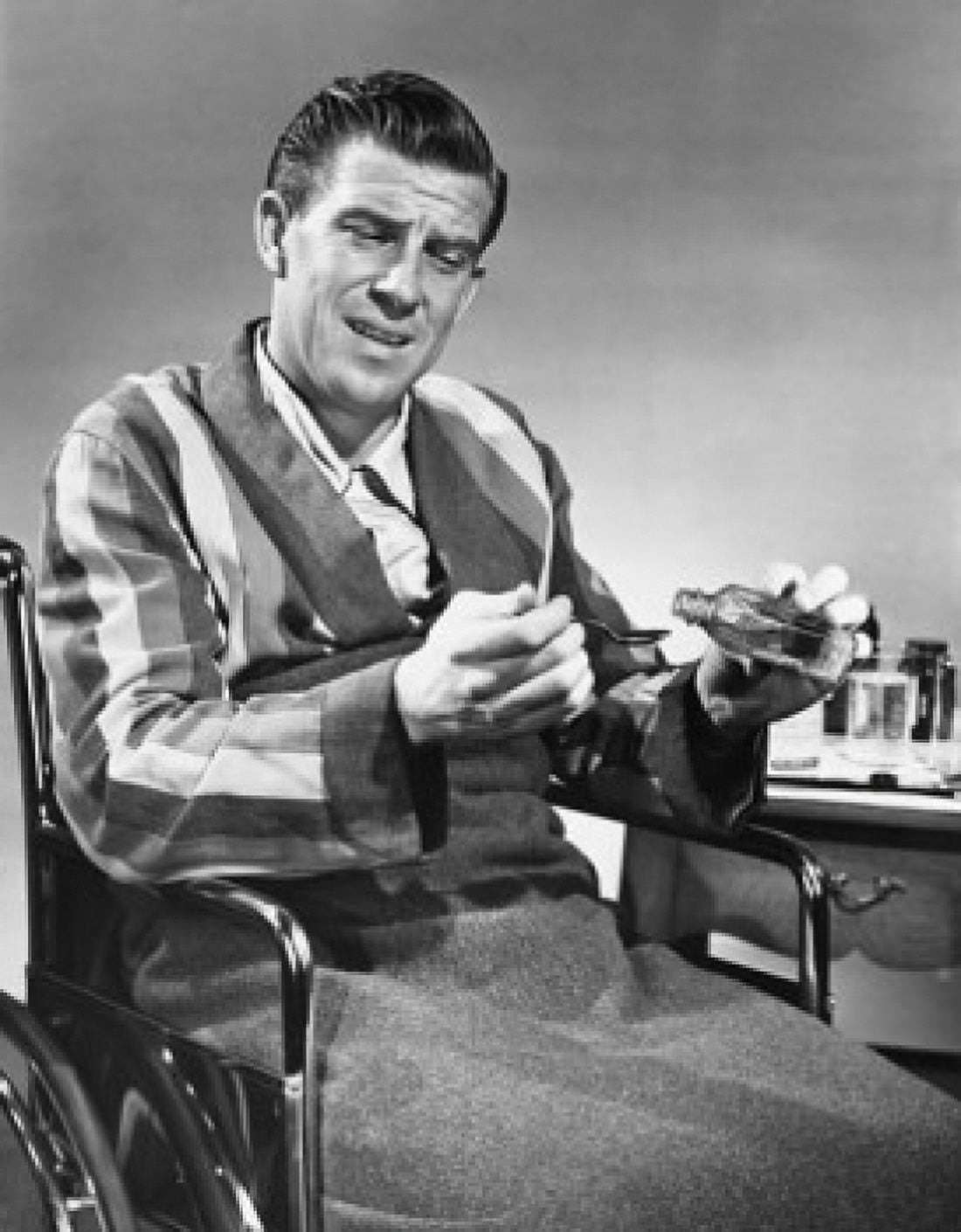 Mature man in wheelchair pouring medicine into a spoon Canvas Art - (18 x 24)