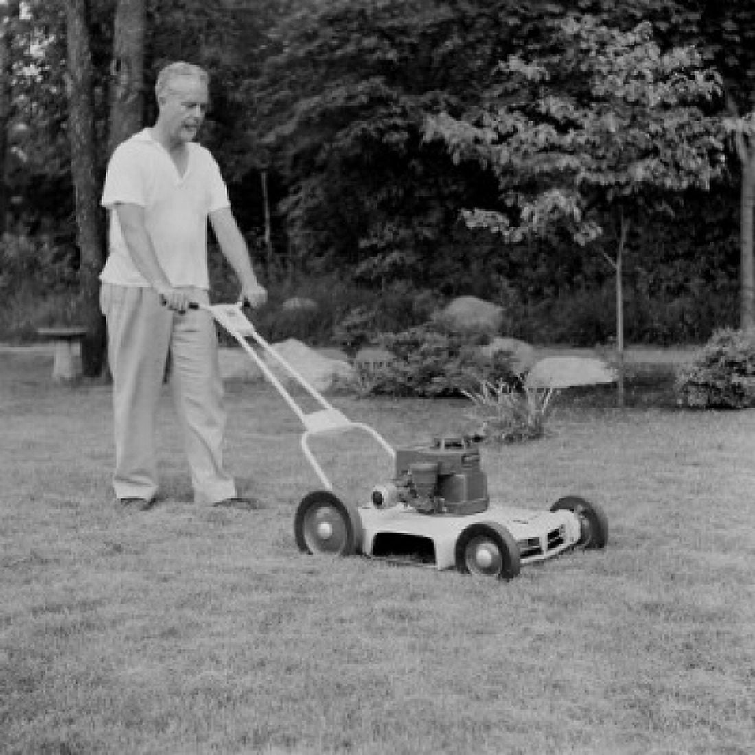 Mature man lawn mowing Canvas Art - (18 x 24)