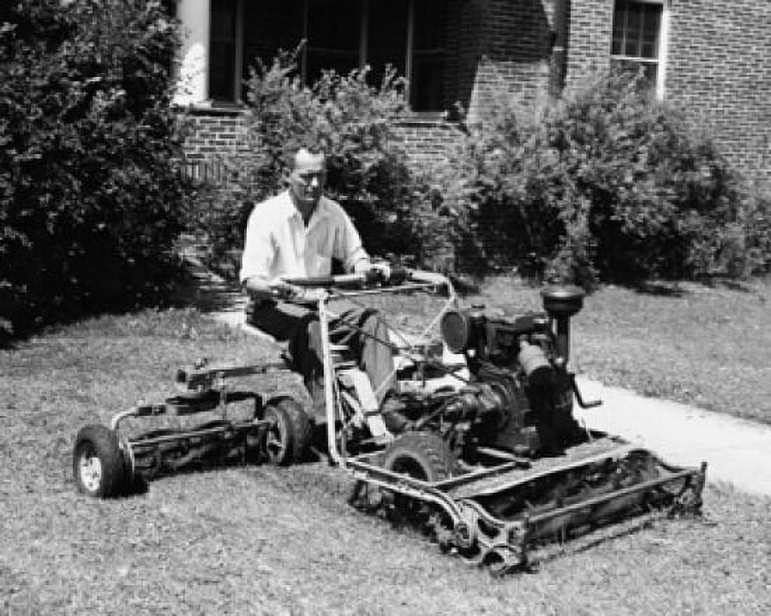 Mature man mowing the lawn with a lawn mower Canvas Art - (24 x 36)