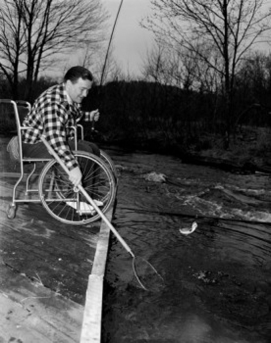 Mature man on wheelchair catching fish Canvas Art - (18 x 24)