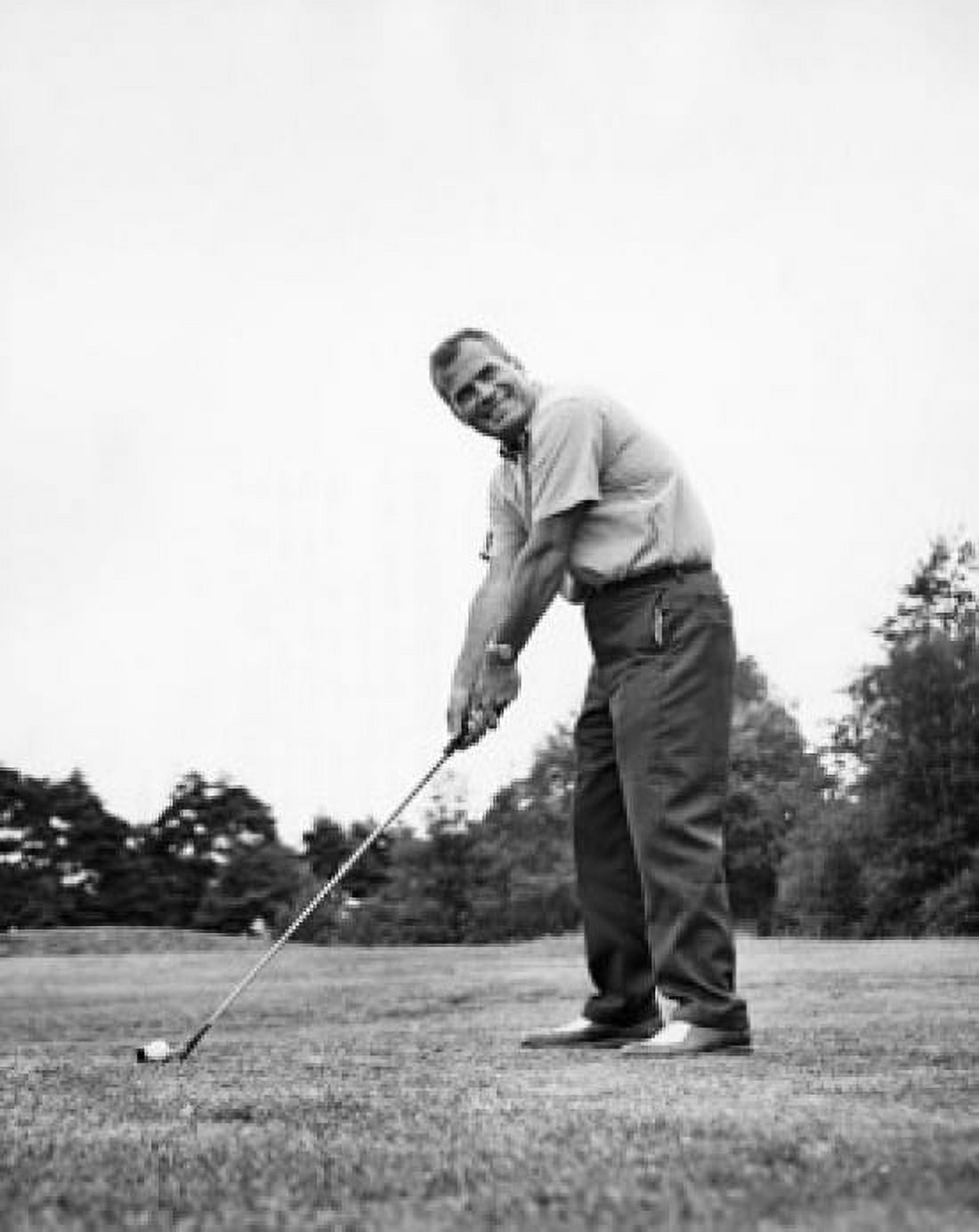 Mature man playing golf on a golf course Canvas Art - (24 x 36)