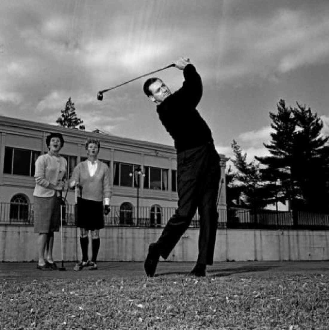Mature man plying golf while pair of women is watching Canvas Art - (18 x 24)