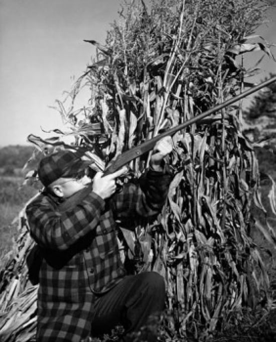 Mature man shooting with a rifle Canvas Art - (24 x 36)