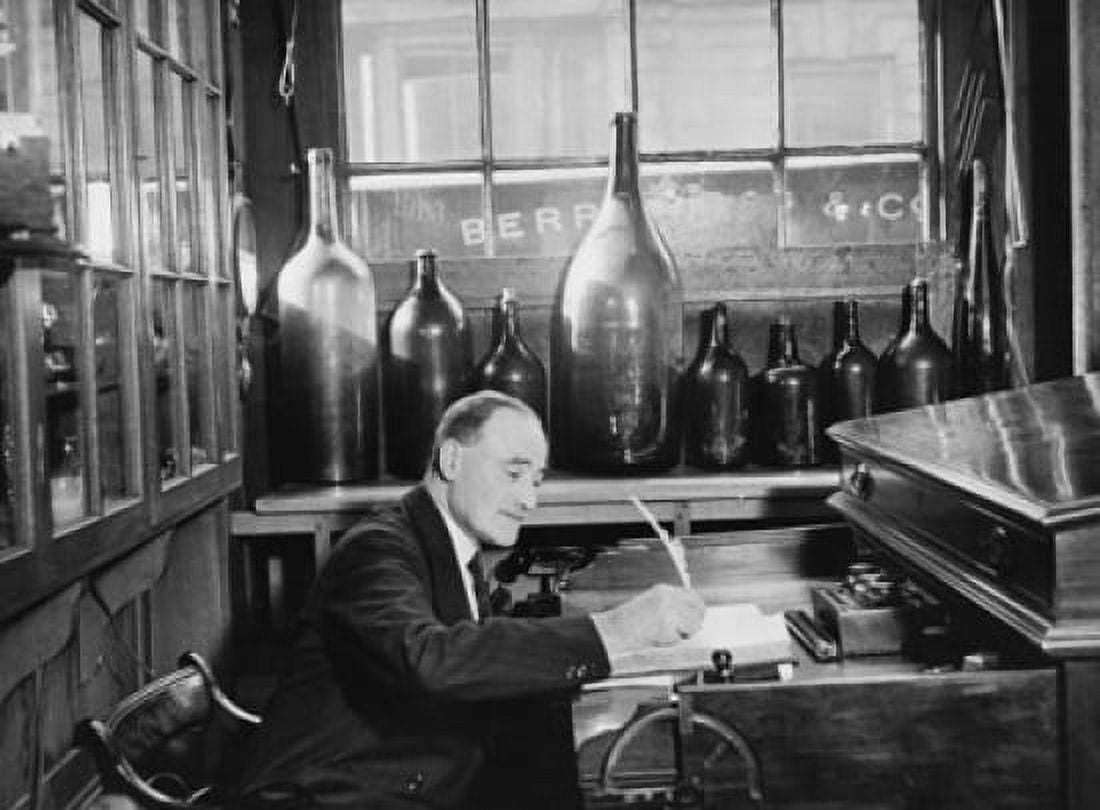 Mature man sitting in a wine shop London England Canvas Art - (24 x 36)
