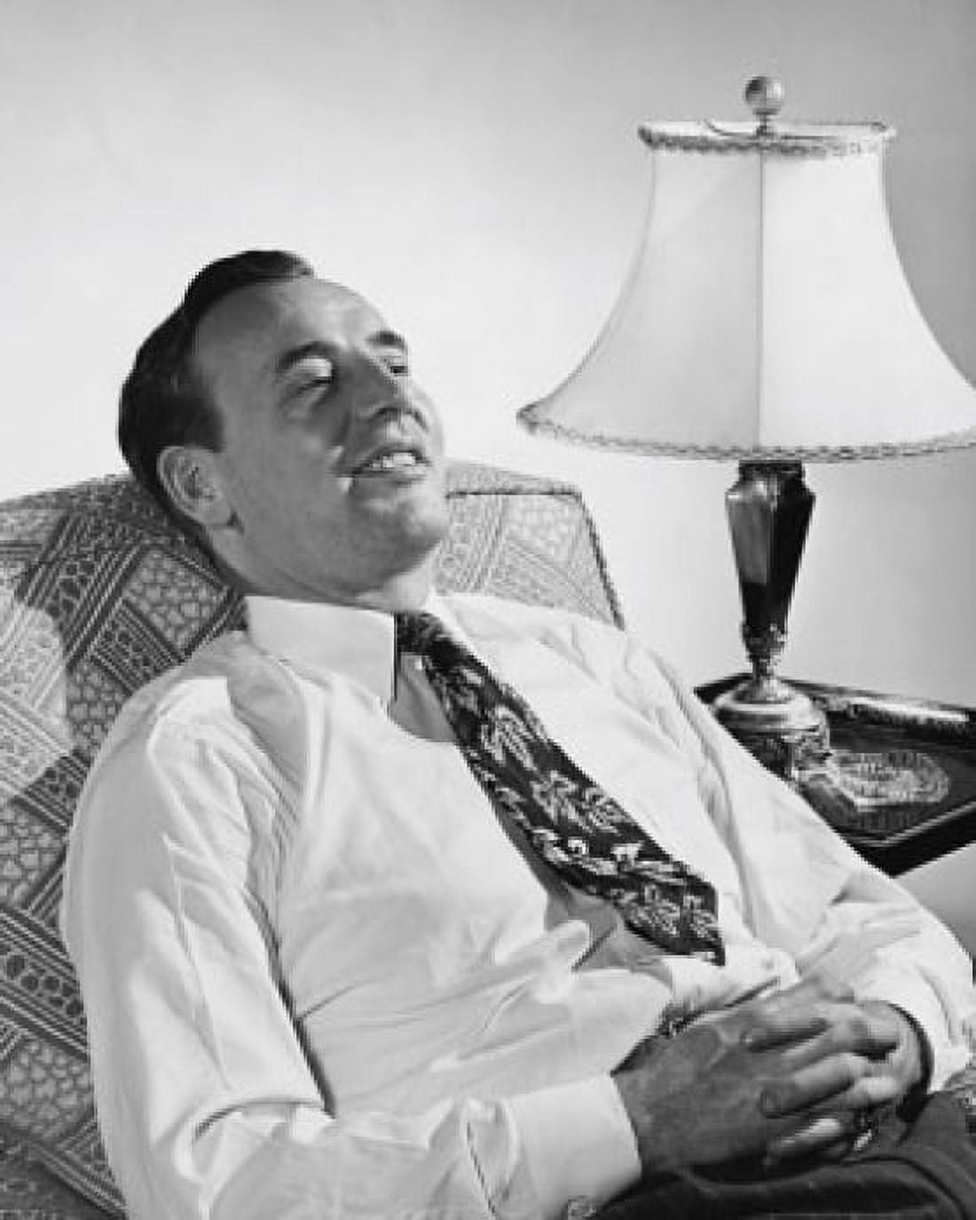 Mature man sitting in an armchair and smiling Canvas Art - (18 x 24)