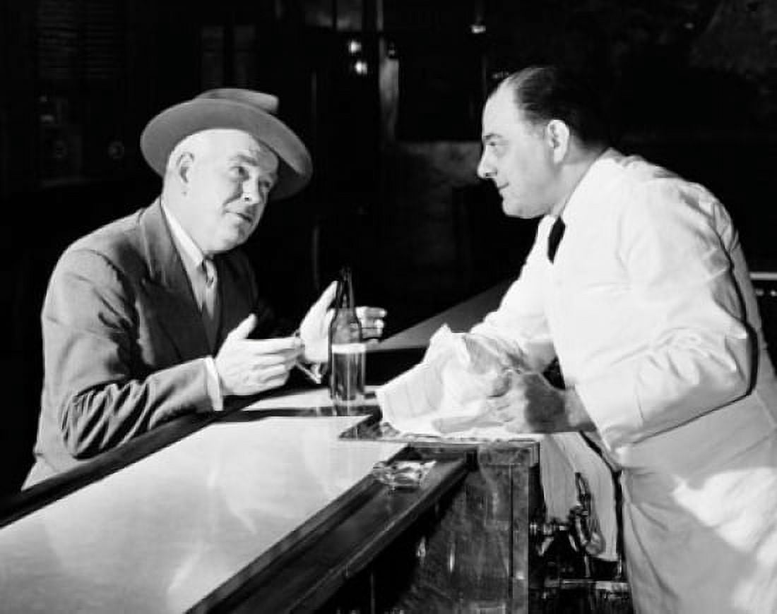 Mature man talking to a bartender Canvas Art - (18 x 24)