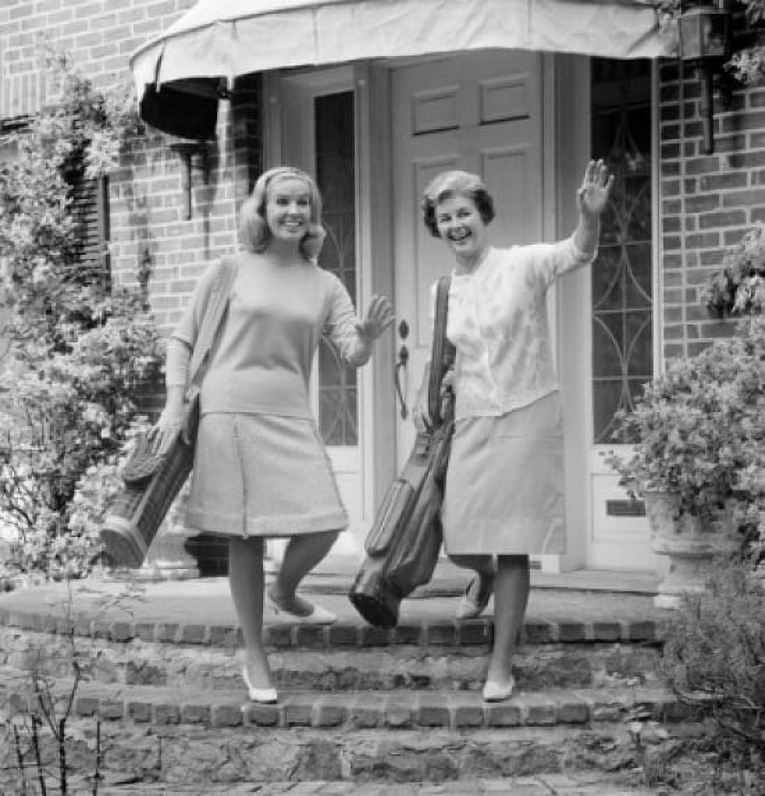 Mature woman and young woman standing on steps of house Canvas Art - (24 x 36)