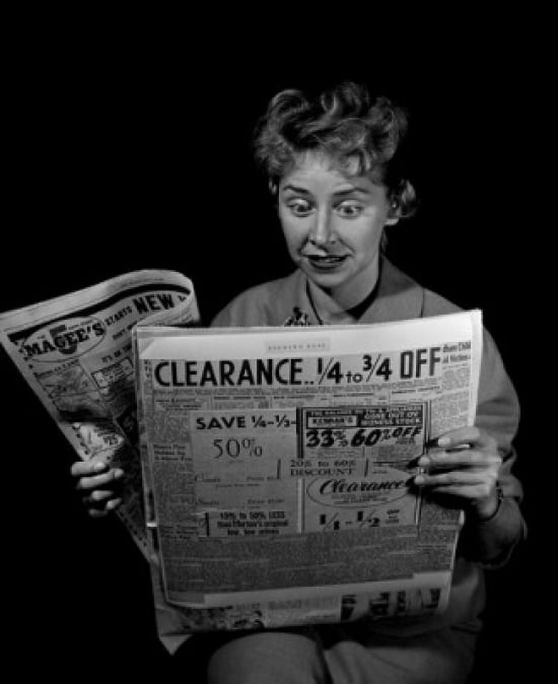 Mature woman reading newspaper Canvas Art - (24 x 36)
