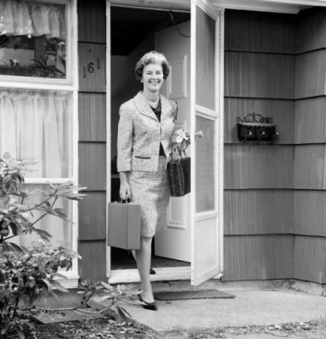 Mature woman walking out home Canvas Art - (18 x 24)