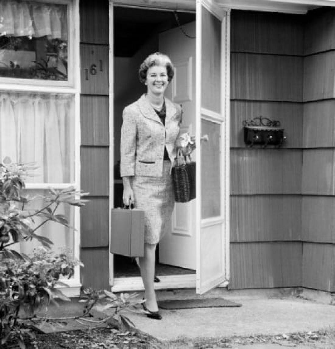Mature woman walking out home Canvas Art - (24 x 36)