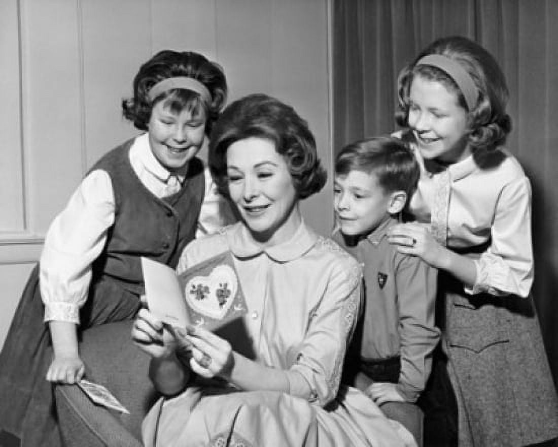 Mature woman with her three children looking at a Valentine Canvas Art - (18 x 24)