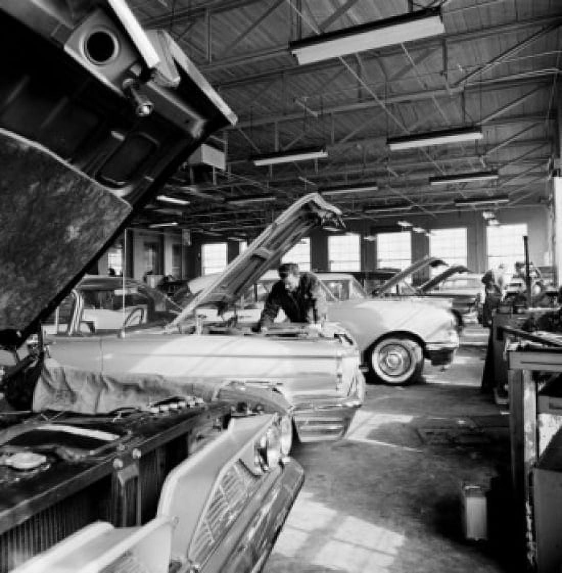 Mechanics working on cars in garage Canvas Art - (24 x 36)