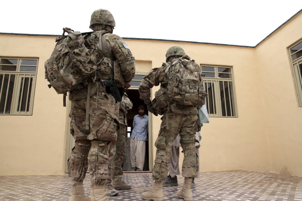 Members of Provincial Reconstruction Team Farah prepare to enter a building Canvas Art - Stocktrek Images (35 x 23)